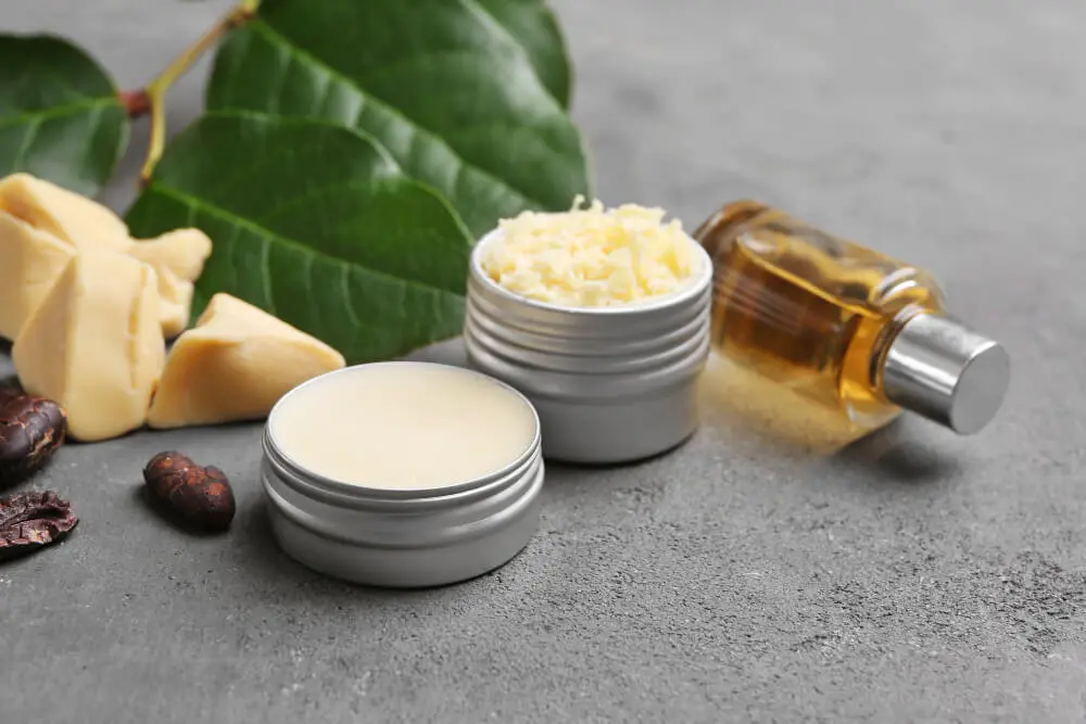 beautiful composition with cocoa butter lotion and ingredients on table jpg