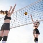 low angle women playing volleyball