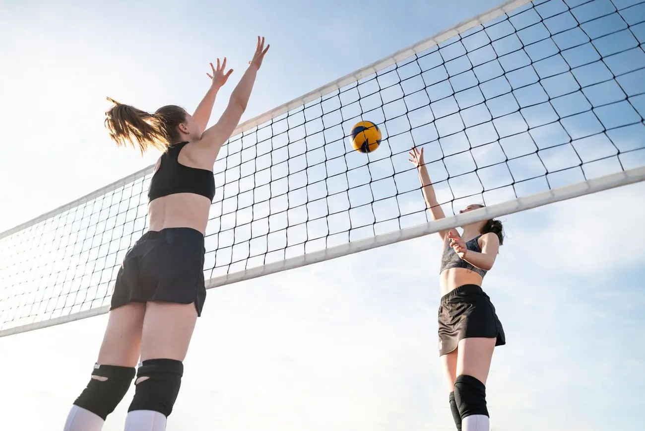 low angle women playing volleyball jpg